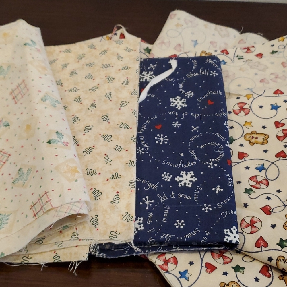 Set of 14 winter fabrics, primarily blue, green, and red.
